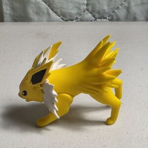 Yellow and White Collectible Figure